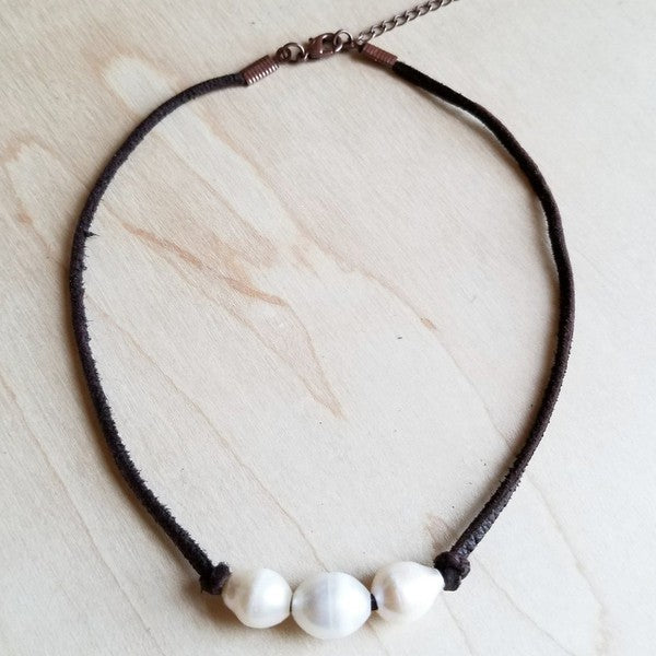 Three white freshwater pearls on dark brown leather choker necklace