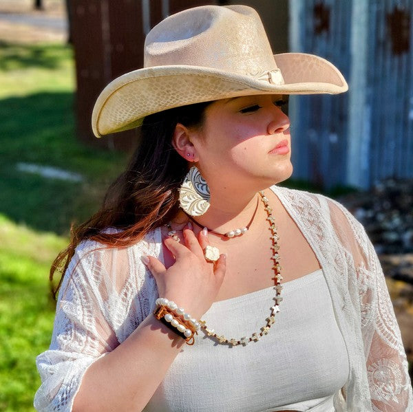 "Pearl and leather choker necklace worn at neck showing adjustable fit"