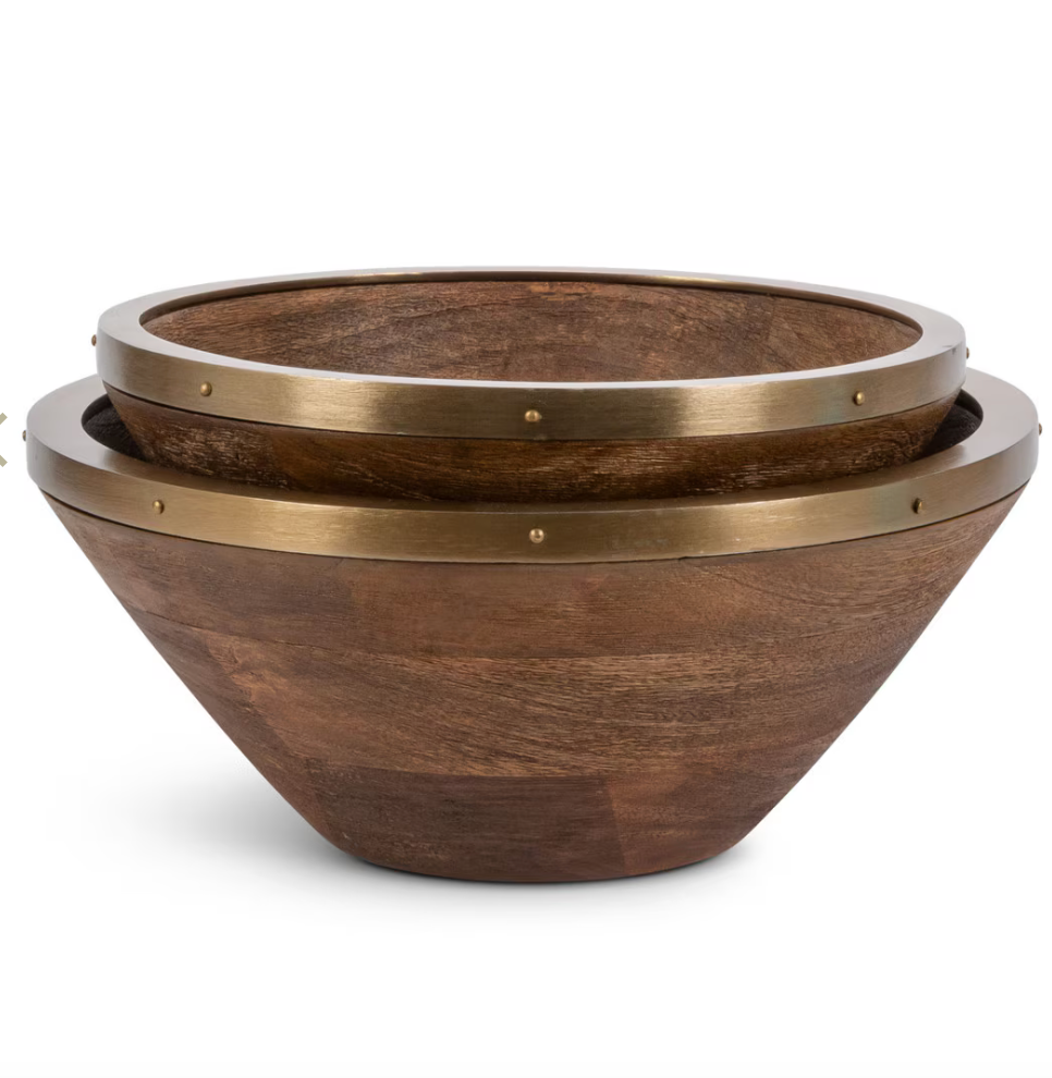Two wooden bowls with brass accents on a white background