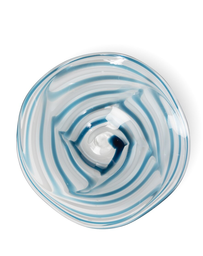 Glass bowl with blue and white swirl pattern on a white background