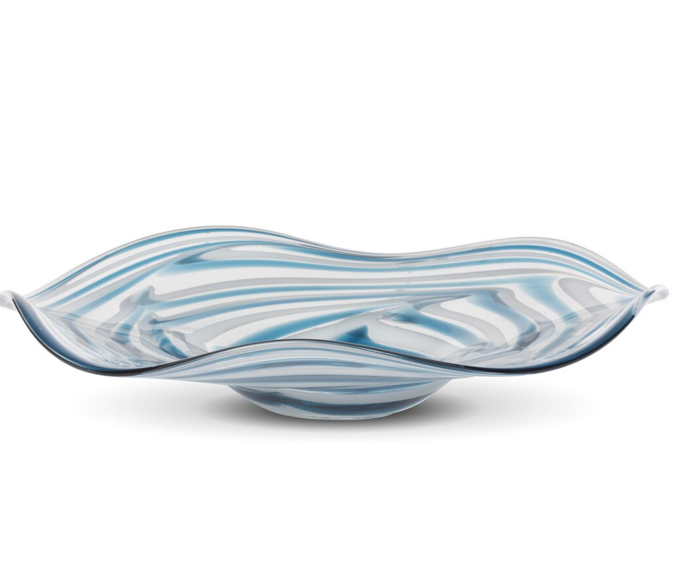 Blue and white wavy glass bowl on a white background