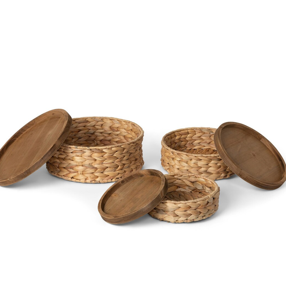Set of woven baskets with lids on a white background