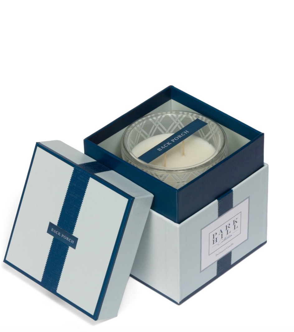 Candle in a decorative box with 'Black Porch' branding on a white background