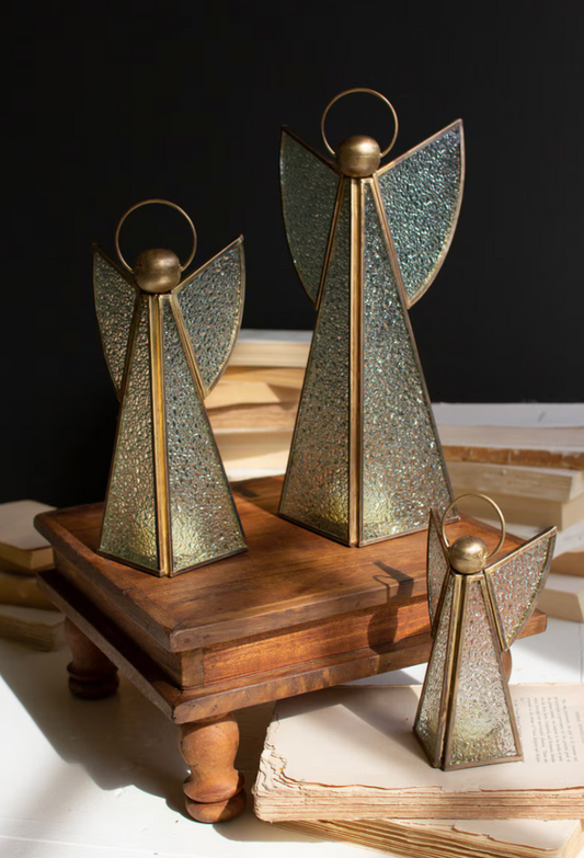  Full set of 3 in graduated sizes on wooden riser with books, dark background