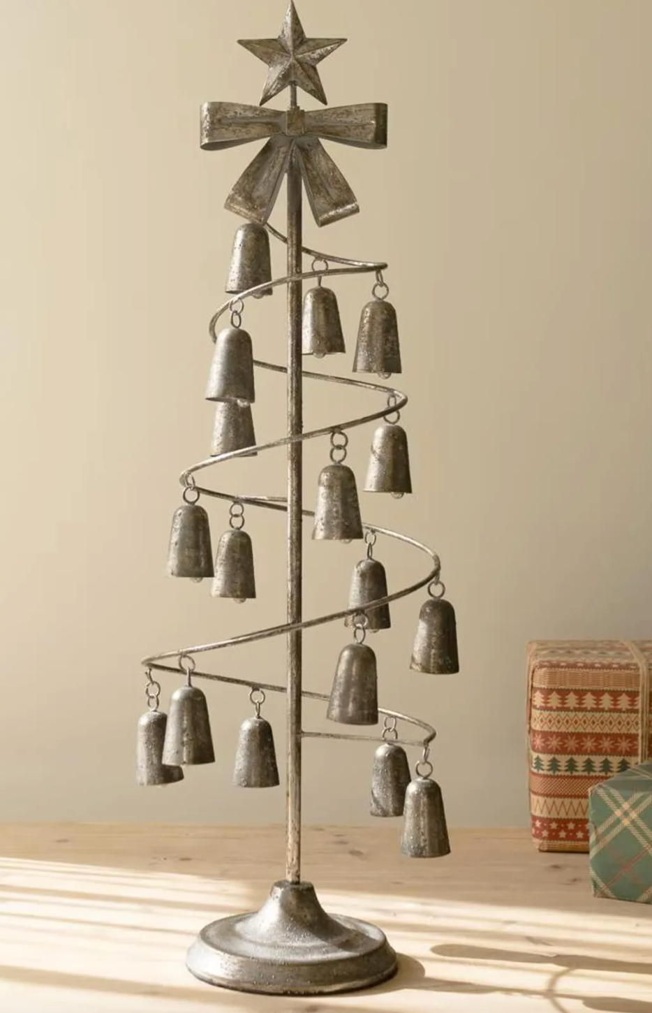 Metal Christmas Tree with hanging bells and a bow and star on top/ 
